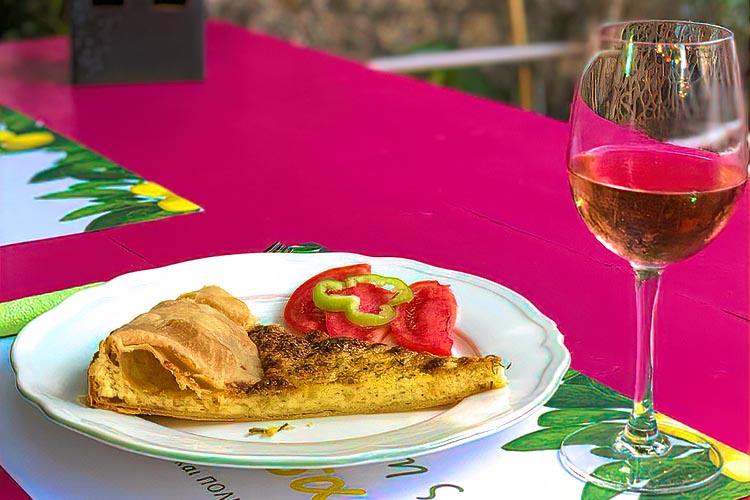 Delicious ladenia with a glass of rose wine at Yioryitsas Backyard in Kardamyli, Greece